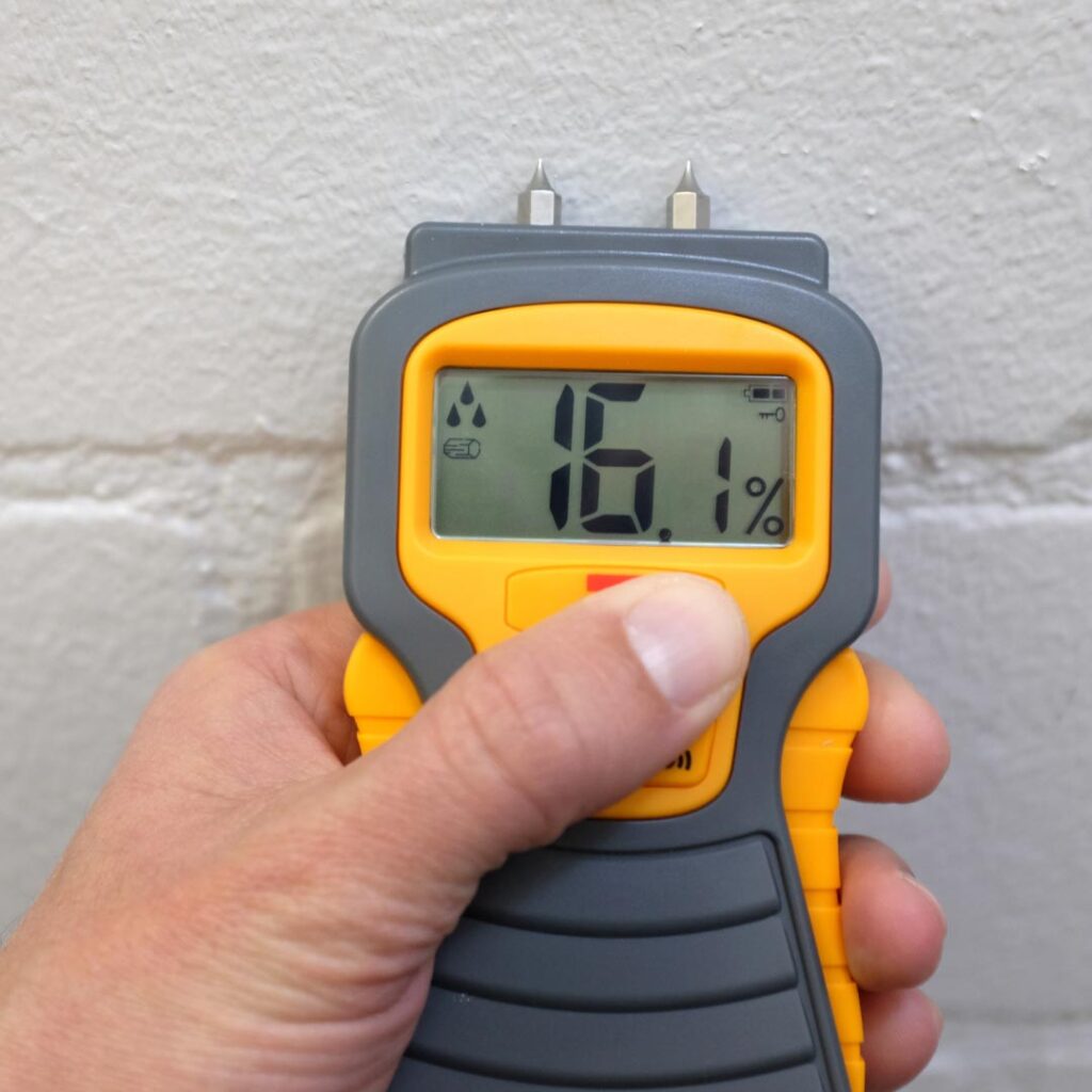 Using moisture meter on wall