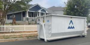 Austin home with All Nation Restoration Dumpster rentals out front